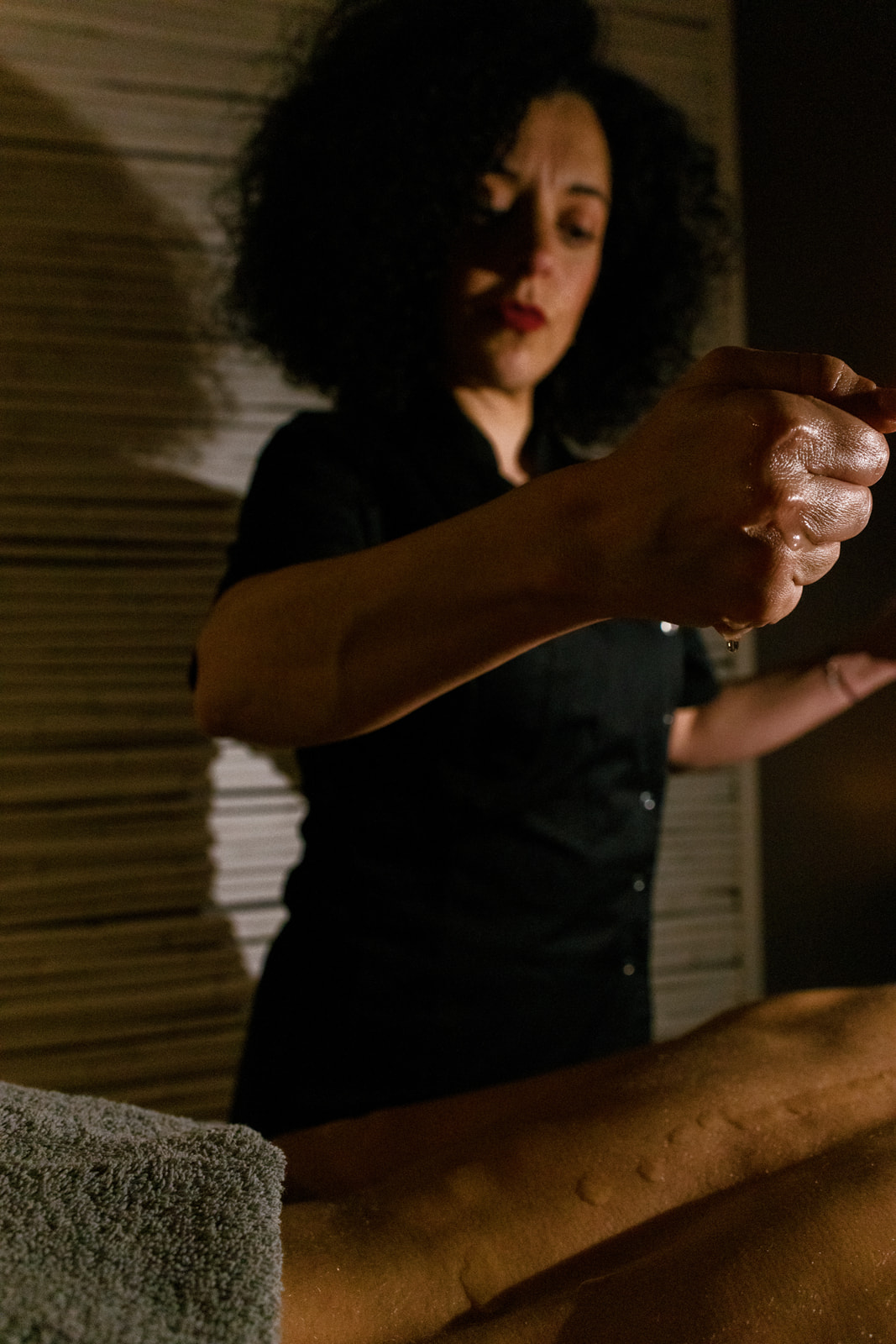 Warm oil being poured during a wellness Naxos treatment